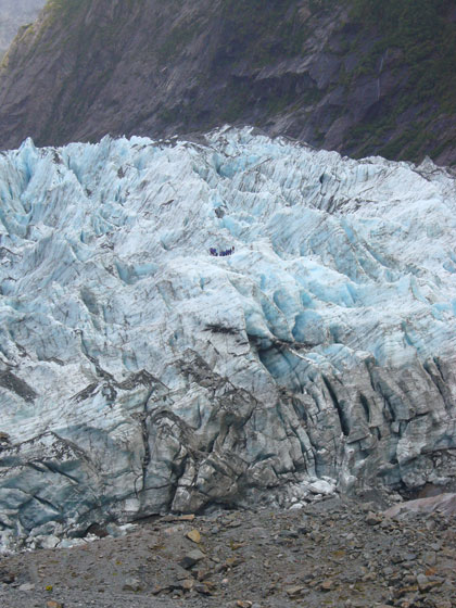 It's difficult to convey the monstrous enormity that is the Franz Josef glacier but this photo goes a little way to doing that.  It's of the terminal face and the you may just be able to make out eleven people in the centre of the ice.  I did this trip on the glacier (without the kids) after missing out on the heli-hike.  It was brilliant to walk on this enormous feat of nature! <br />
Gabby x