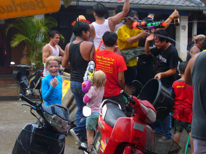 Lao New Year - The country's biggest festival held in April every year.   The 3 day holiday involves a lot of getting wet.  The girls armed themselves with the biggest water pistols they could find and gave as much as they received..........