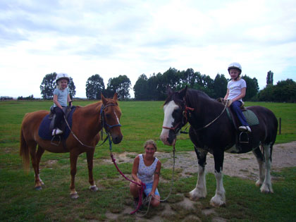 Ella and Florence on Ginger & Star on their horse ride in Marahau - bigger horses than they have ever had before!