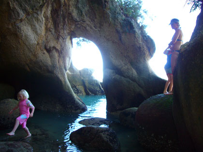 Exploring some caves during our stop at a secluded beach in the Abel Tasman National Park. South Island. NZ.